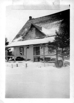 001- Mattewa - The Front of the house in Mattewa. Burned down just before Grandma Harper died. The snow is deep here because that porch had 3 to 4 steps leading up to it.